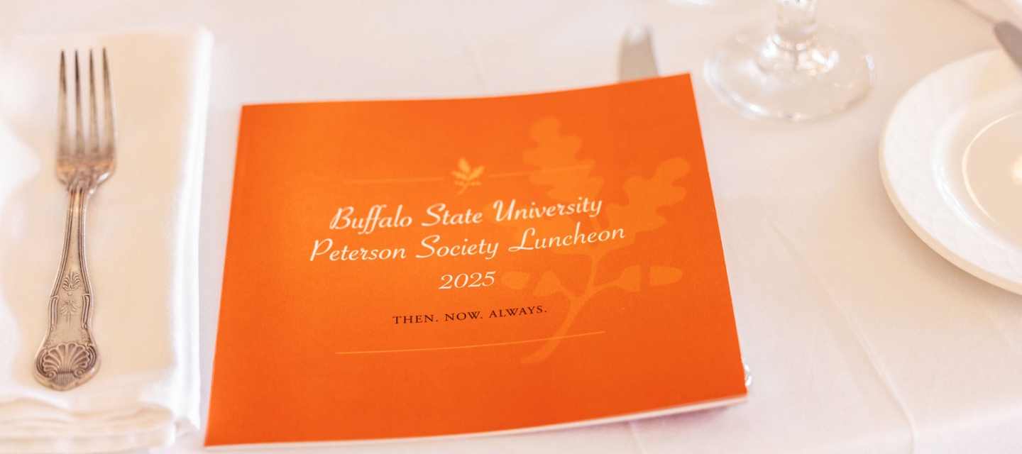 A table setting with a brochure